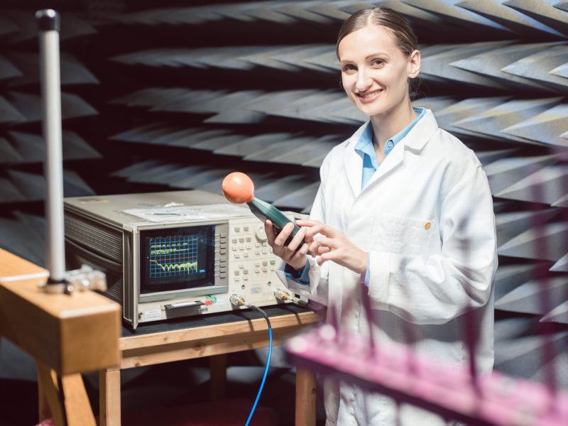 Engineer in electronics lab performing rf compliance test